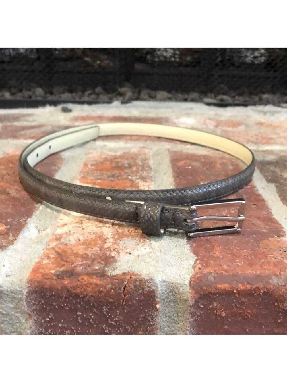 Women’s narrow gray reptile textured belt. 1/2” wide. 36” long.
